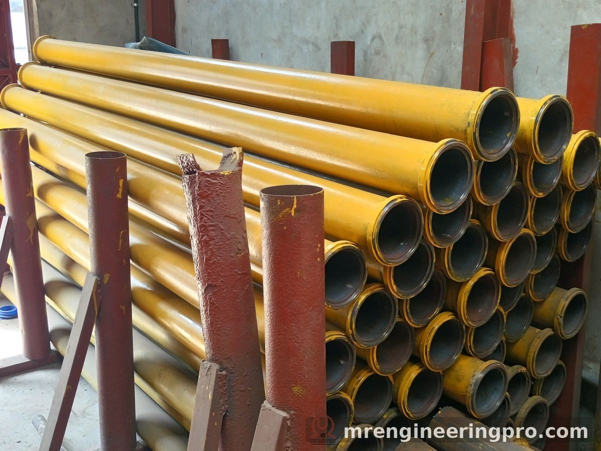 Stock of DN125 concrete delivery pipes with welded end collars at M. R. Engineering, Naroda Road